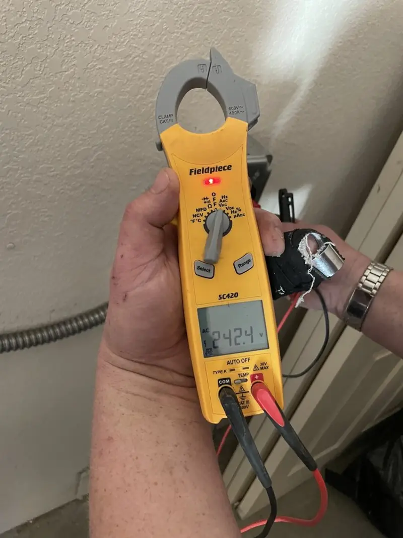 Voltage testing with clamp meter during Circuit Breaker Repair in Guthrie